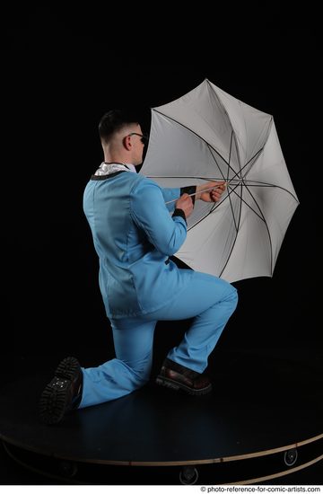 Man Adult Muscular White Fighting without gun Kneeling poses Business