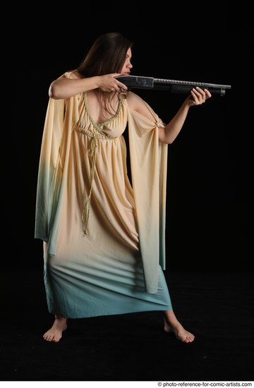 Woman Adult Average White Standing poses Casual Fighting with shotgun