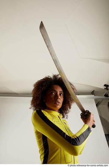 Woman Adult Average Black Fighting with sword Standing poses Casual