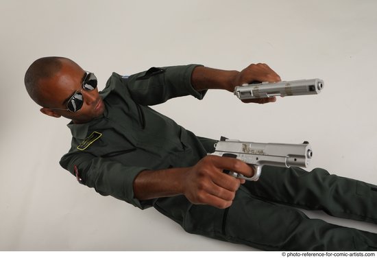 Man Adult Average Black Fighting with gun Sitting poses Casual