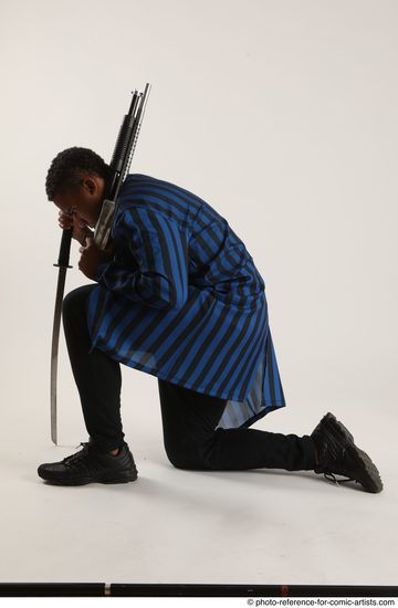 Man Adult Average Black Kneeling poses Casual Fighting with shotgun