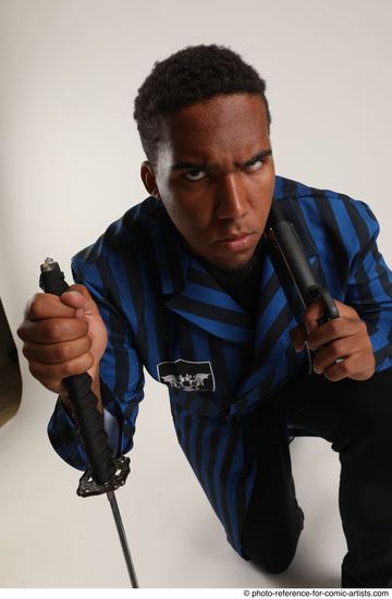 Man Adult Average Black Kneeling poses Casual Fighting with shotgun