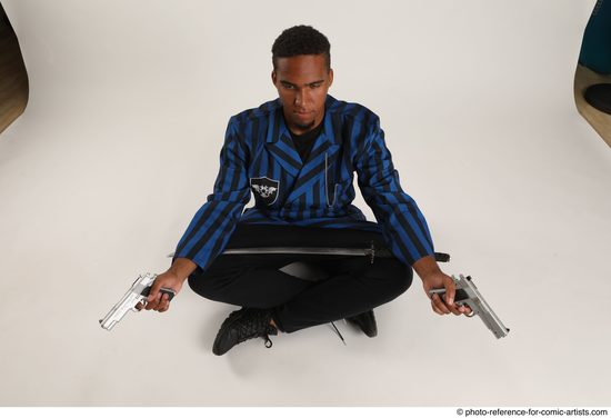 Man Adult Average Black Fighting with gun Sitting poses Casual