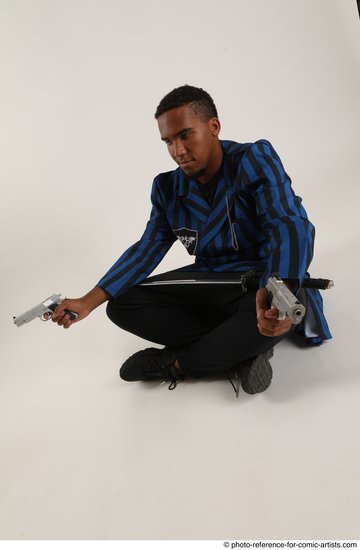 Man Adult Average Black Fighting with gun Sitting poses Casual