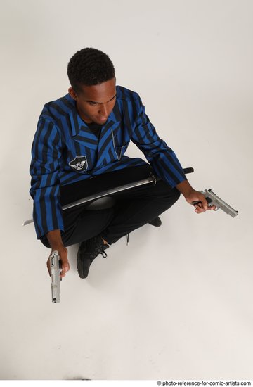 Man Adult Average Black Fighting with gun Sitting poses Casual