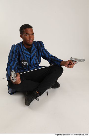 Man Adult Average Black Fighting with gun Sitting poses Casual