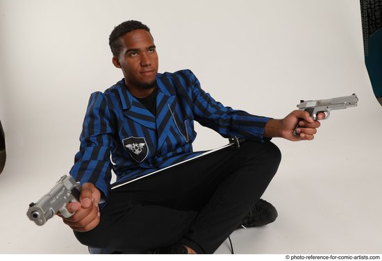 Man Adult Average Black Fighting with gun Sitting poses Casual