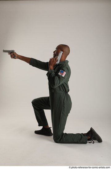 Man Adult Average Black Fighting with gun Kneeling poses Casual