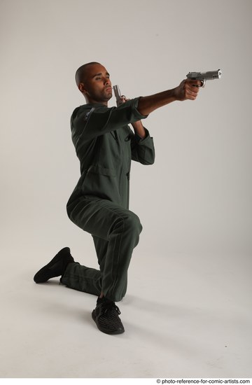 Man Adult Average Black Fighting with gun Kneeling poses Casual