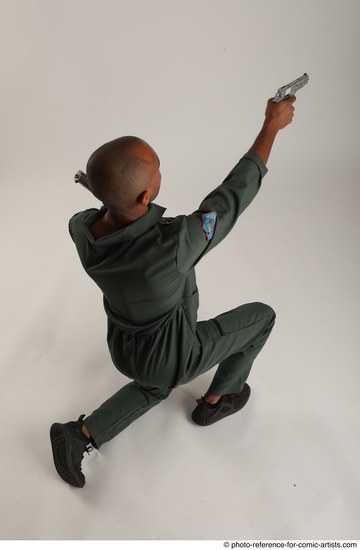 Man Adult Average Black Fighting with gun Kneeling poses Casual