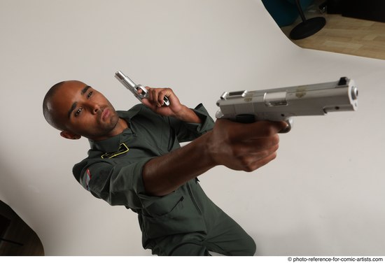 Man Adult Average Black Fighting with gun Kneeling poses Casual