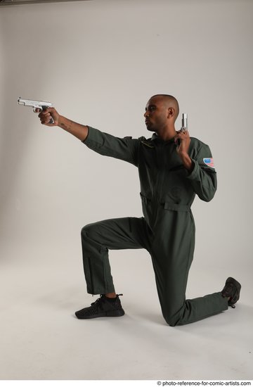 Man Adult Average Black Fighting with gun Kneeling poses Casual