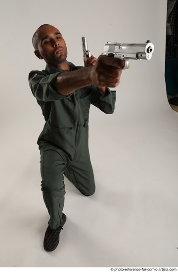 Man Adult Average Black Fighting with gun Kneeling poses Casual