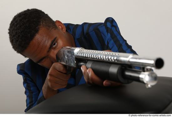 Man Adult Average Black Kneeling poses Casual Fighting with shotgun