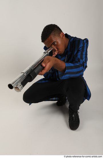 Man Adult Average Black Kneeling poses Casual Fighting with shotgun