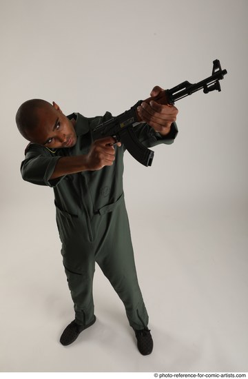 Man Adult Average Black Fighting with gun Standing poses Army