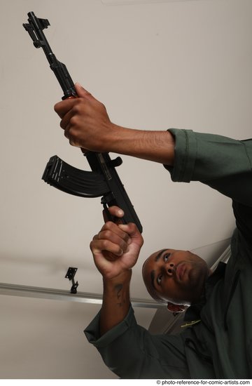 Man Adult Average Black Fighting with gun Standing poses Army