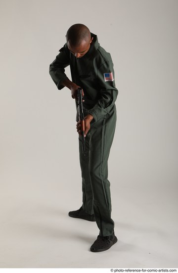 Man Adult Average Black Fighting with gun Standing poses Army