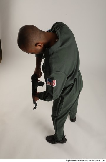 Man Adult Average Black Fighting with gun Standing poses Army