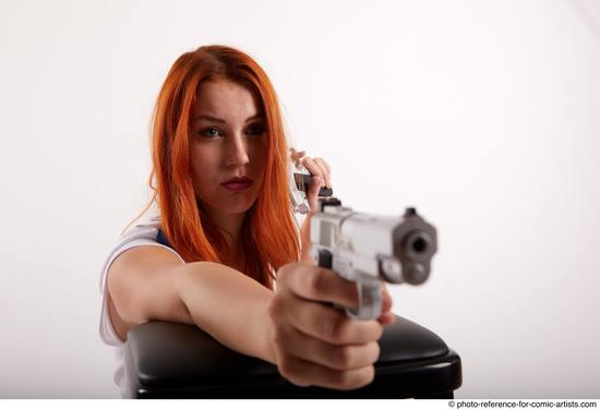 Woman Adult Average White Fighting with gun Kneeling poses Casual