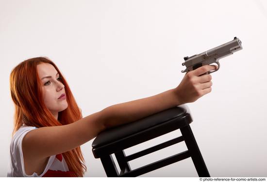 Woman Adult Average White Fighting with gun Kneeling poses Casual