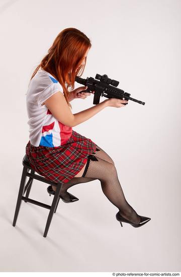 Woman Adult Average White Fighting with gun Sitting poses Casual