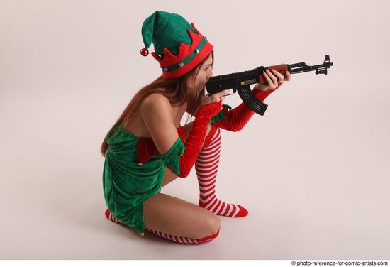 Woman Adult Average White Fighting with gun Kneeling poses Casual