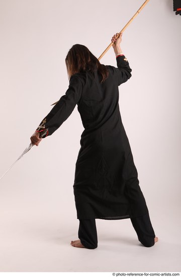 Man Adult Average White Fighting with sword Standing poses Coat