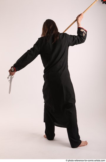 Man Adult Average White Fighting with sword Standing poses Coat