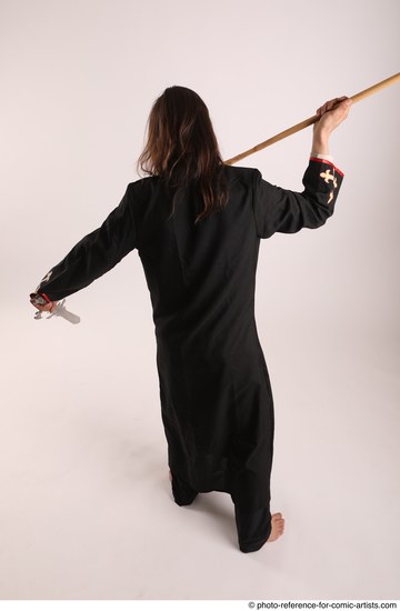 Man Adult Average White Fighting with sword Standing poses Coat