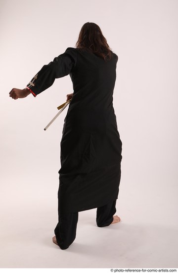 Man Adult Average White Fighting with sword Standing poses Coat