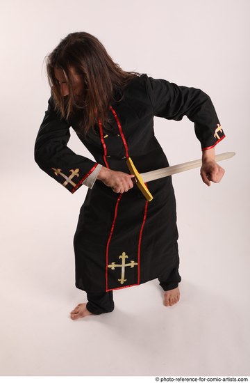 Man Adult Average White Fighting with sword Standing poses Coat