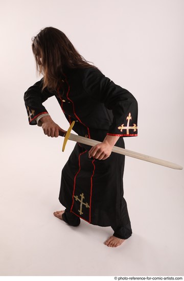 Man Adult Average White Fighting with sword Standing poses Coat