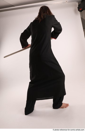 Man Adult Average White Fighting with sword Standing poses Coat