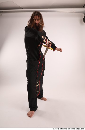 Man Adult Average White Fighting with sword Standing poses Coat