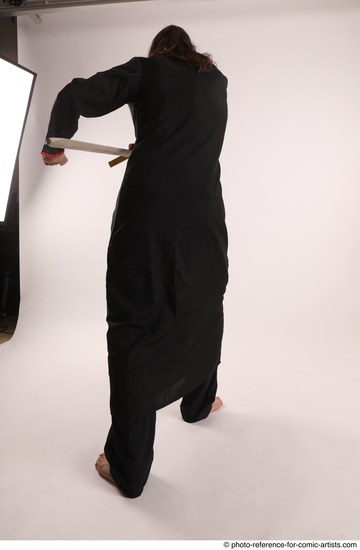 Man Adult Average White Fighting with sword Standing poses Coat