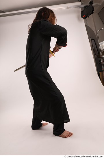 Man Adult Average White Fighting with sword Standing poses Coat