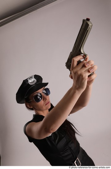 Woman Adult Athletic White Fighting with gun Standing poses Casual