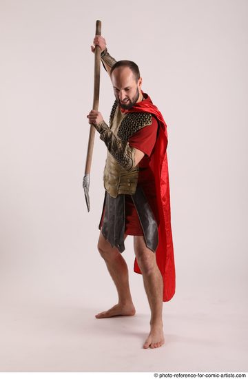 Man Adult Average White Fighting with spear Standing poses Casual