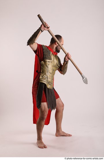 Man Adult Average White Fighting with spear Standing poses Casual