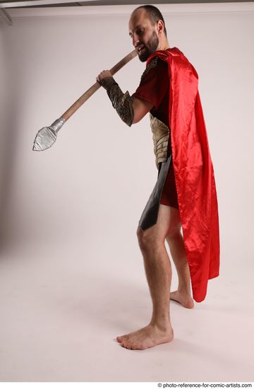 Man Adult Average White Fighting with spear Standing poses Casual