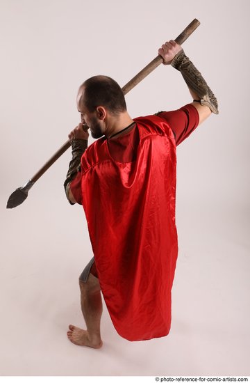 Man Adult Average White Fighting with spear Standing poses Casual