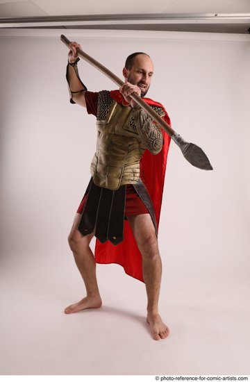 Man Adult Average White Fighting with spear Standing poses Casual