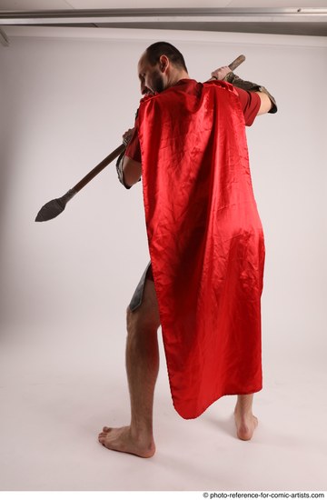 Man Adult Average White Fighting with spear Standing poses Casual