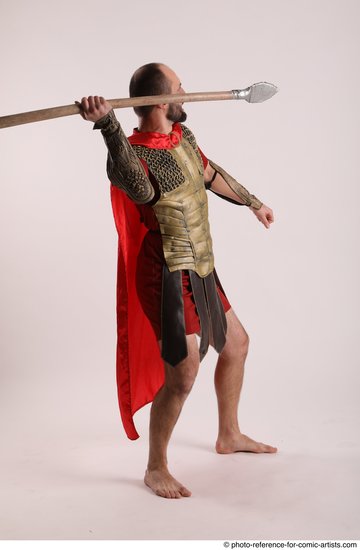 Man Adult Average White Fighting with spear Standing poses Casual