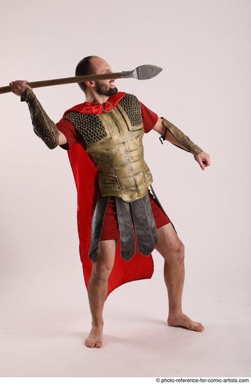 Man Adult Average White Fighting with spear Standing poses Casual