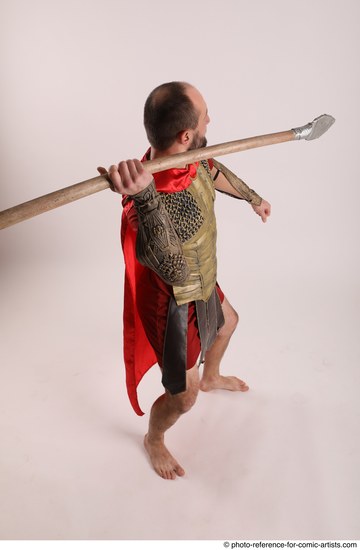 Man Adult Average White Fighting with spear Standing poses Casual