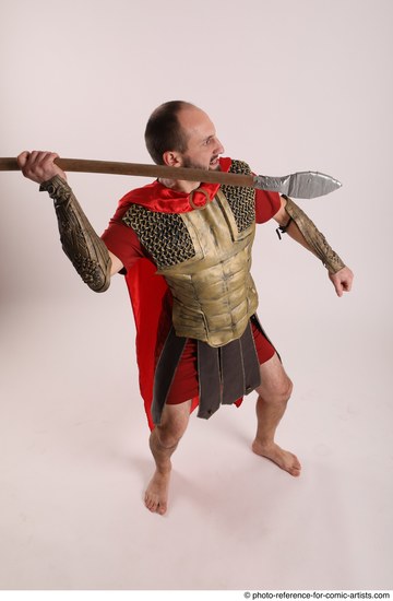 Man Adult Average White Fighting with spear Standing poses Casual