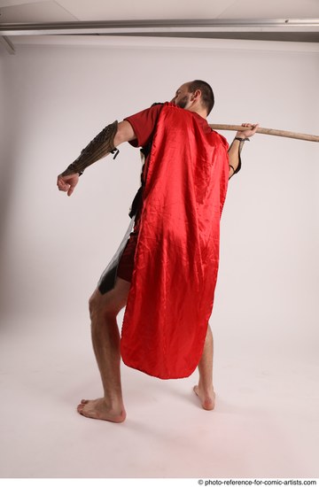 Man Adult Average White Fighting with spear Standing poses Casual