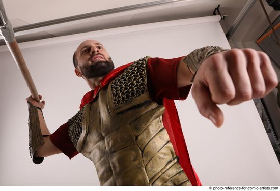 Man Adult Average White Fighting with spear Standing poses Casual